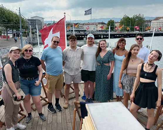 Study Abroad students pose outside waterway in Geneva, Switzerland