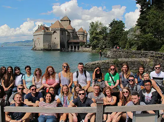 Study Abroad students in front of historical structure in Geneva